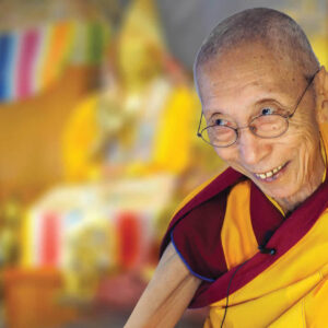Buddhist Geshla with smile and blured background image